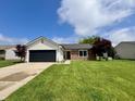 Attractive single-Gathering home featuring a well-manicured front yard on a sunny day at 204 Meadow Creek S Dr, Whiteland, IN 46184