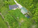 Spacious property with a fenced backyard, outbuilding, and trampoline, ideal for Gathering fun and outdoor activities at 2935 N Grizzly Ln, Martinsville, IN 46151