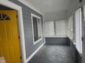 Inviting enclosed porch with abundant natural light, gray paint, and new windows at 322 S Rural St, Indianapolis, IN 46201