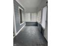 Inviting enclosed porch with abundant natural light, gray paint, and new windows at 322 S Rural St, Indianapolis, IN 46201
