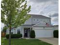 Charming two-story home with gray siding, well-maintained landscaping, and a two-car garage at 3292 Underwood Dr, Whiteland, IN 46184
