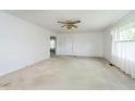 Bright living room featuring neutral walls, carpet and a ceiling fan at 3642 S Mauxferry Rd, Franklin, IN 46131