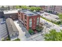 Apartment building with brick facade, balconies, and meticulously landscaped grounds at 404 E New York E St # 406, Indianapolis, IN 46202
