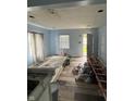 Spacious living room with new floors and light blue walls offering great potential for customization at 4106 N Pasadena Ave, Indianapolis, IN 46226