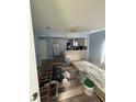 Open living area showcasing new floors, and kitchen renovation progress with modern design and lighting at 4106 N Pasadena Ave, Indianapolis, IN 46226