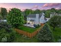 Backyard view with patio, privacy fence and mature trees create a peaceful outdoor living space at 5041 Millwright Ct, Indianapolis, IN 46254