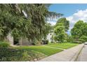 Lovely home with a spacious front lawn and mature trees, offering great curb appeal at 5117 N Park Ave, Indianapolis, IN 46205