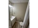 Well-lit half bathroom featuring modern fixtures and stylish design elements at 5735 Liberty Creek E Dr, Indianapolis, IN 46254