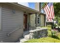 Close up of front porch with stone accents, inviting entrance, and lovely landscaping at 601 Conner Creek Dr, Fishers, IN 46038