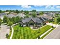 A beautiful home in a picturesque neighborhood, showcasing lush greenery at 7116 Trail Ridge Ln, Indianapolis, IN 46259