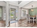 Inviting foyer with high ceilings, an open floor plan, and stylish flooring leading to dining area at 8635 Nolan Dr, Fishers, IN 46038