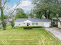 A bird's eye view of a beautiful single-story home with an attached garage at 953 W Clinton St, Danville, IN 46122