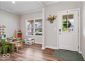 Bright playroom filled with toys, a window, and a clear view of the front door at 10993 Liberation Trce, Noblesville, IN 46060