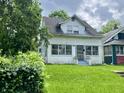 Charming two-story home with a lush lawn, offering a serene and inviting atmosphere at 1137 W 34Th St, Indianapolis, IN 46208