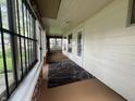Enclosed front porch with lots of light, a neutral rug, and ample space at 1137 W 34Th St, Indianapolis, IN 46208