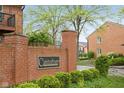 Canterbury Condominiums entrance sign surrounded by lush landscaping at 1150 Canterbury Ct # Apt D, Indianapolis, IN 46260