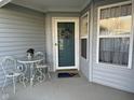 Inviting front porch with welcome mat and seasonal decor at 11523 Coastal Way, Indianapolis, IN 46229