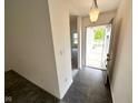 Inviting foyer with new floor and a view of the front yard through the open front door at 11711 Whisper Cove Dr, Fishers, IN 46037