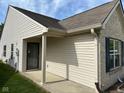 Covered side entrance of home, featuring siding, and brick details at 11711 Whisper Cove Dr, Fishers, IN 46037