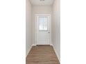 Entryway with wood-look floors and a front door with a window at 1237 Langham St, Avon, IN 46123