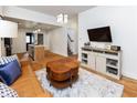 Cozy living area showcasing stylish decor, hardwood floors, and an open concept design at 1730 Hoyt Ave, Indianapolis, IN 46203