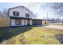 Attractive exterior elevation showcasing a two-story home with an attached two car garage at 1808 Raible Ave, Anderson, IN 46011