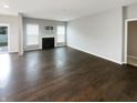 Spacious living room featuring a fireplace and hardwood flooring at 18230 Sandy Cove Ln, Westfield, IN 46074
