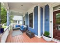 Inviting front porch with cozy seating, perfect for relaxing and enjoying the outdoors at 2191 Greencroft St, Carmel, IN 46032