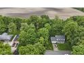 Aerial view of property showcasing lush greenery, nearby fields, and the home's location in a serene setting at 2397 Lincoln Dr, Cicero, IN 46034