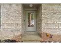 Close-up of front door surrounded by brickwork and decorative elements at 2397 Lincoln Dr, Cicero, IN 46034