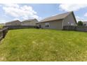 A spacious, flat backyard offers ample green space, perfect for outdoor activities and relaxation at 2717 Arklow Way, Brownsburg, IN 46112