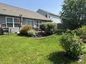 A lovely backyard with an open lawn, patio, and tasteful landscaping at 2911 W Hawanian Ln, Monrovia, IN 46157