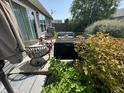 Cozy patio seating area with a grill surrounded by lush landscaping at 2911 W Hawanian Ln, Monrovia, IN 46157