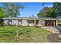 Beautiful brick ranch home with attached garage and well-kept lawn on a sunny day at 2956 N 700 E, Franklin, IN 46131