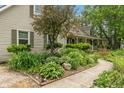 Beautiful landscaping and a winding sidewalk to the quaint covered front porch at 3631 S 450 E, Whitestown, IN 46075