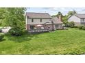 Spacious backyard with a large deck perfect for outdoor entertaining with a view of the lake at 3708 Gould Dr, Carmel, IN 46033