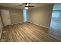 Bright living room with modern flooring and a ceiling fan at 4108 Steinmetz Dr, Indianapolis, IN 46254
