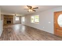 Bright living room with hardwood floors, stone fireplace, and a welcoming atmosphere at 521 Sunset Dr, Edinburgh, IN 46124