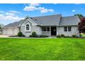 Charming single-story brick home with well-manicured lawn and inviting curb appeal at 6190 S 425 W, Pendleton, IN 46064