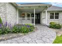 Close-up of front porch with stylish walkway and meticulously maintained landscaping at 6190 S 425 W, Pendleton, IN 46064