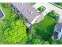 Overhead angle shows unit's patio and lawn area surrounded by mature trees at 7155 Sea Pine Dr, Indianapolis, IN 46250
