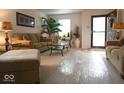 Bright and airy living room with cozy seating, neutral decor, and great natural light at 7737 Wolfgang Pl, Indianapolis, IN 46239
