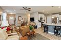 Spacious living room open to the kitchen area, featuring a breakfast bar with seating at 9166 Lieven St, Avon, IN 46123