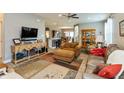 Cozy living room with open floor plan, hardwood floors, and comfortable seating arrangement at 9166 Lieven St, Avon, IN 46123