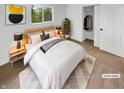 Cozy bedroom featuring a neutral color palette, closet, and soft rug. (Virtually Staged) at 9490 E 36Th Pl, Indianapolis, IN 46235