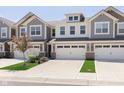 Attractive townhome with a two-car garage and well-maintained landscaping at 9583 Beckett St, Avon, IN 46123