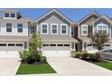 Charming townhome with attached two-car garage and manicured front lawn at 9604 Beckett St, Avon, IN 46123