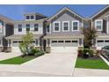 Charming townhome with attached two-car garage and manicured front lawn at 9604 Beckett St, Avon, IN 46123