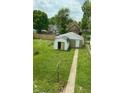 Large backyard with a storage shed, offering ample space for outdoor activities and relaxation at 1322 S Belmont Ave, Indianapolis, IN 46221