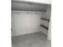 Spacious closet with shelving and bar and marble tile flooring offer plenty of storage space at 1322 S Belmont Ave, Indianapolis, IN 46221